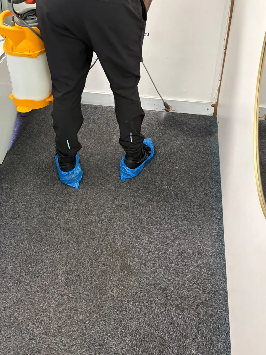 Technician applying pre-spray treatment