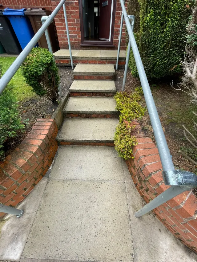 Front entrance concrete steps after jet washing