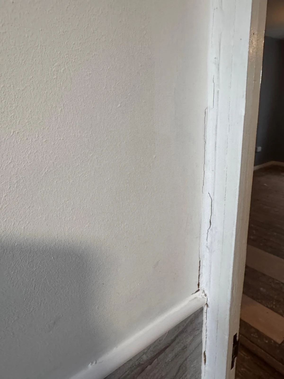 Door frame and architrave being checked before a tenancy clean