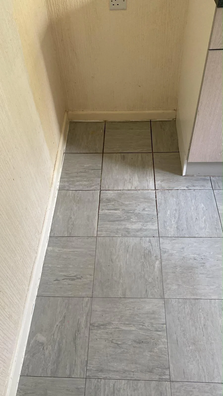 Utility room tiled floor scrubbed clean and dry